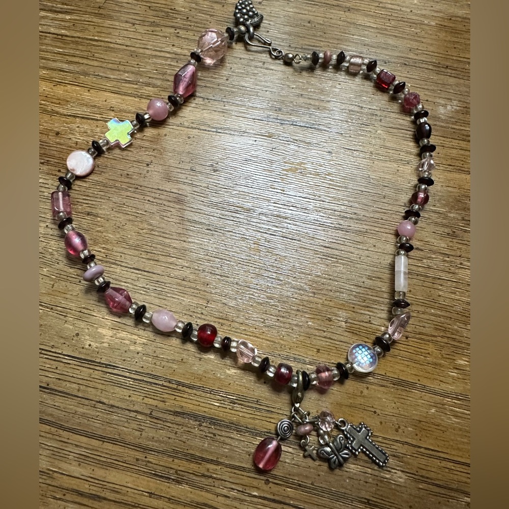 Pink beaded necklace with charms